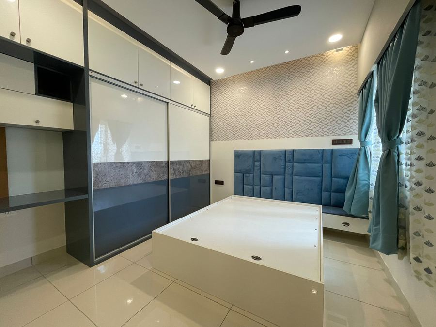 Bedroom with mirrored sliding wardrobe and platform bed base