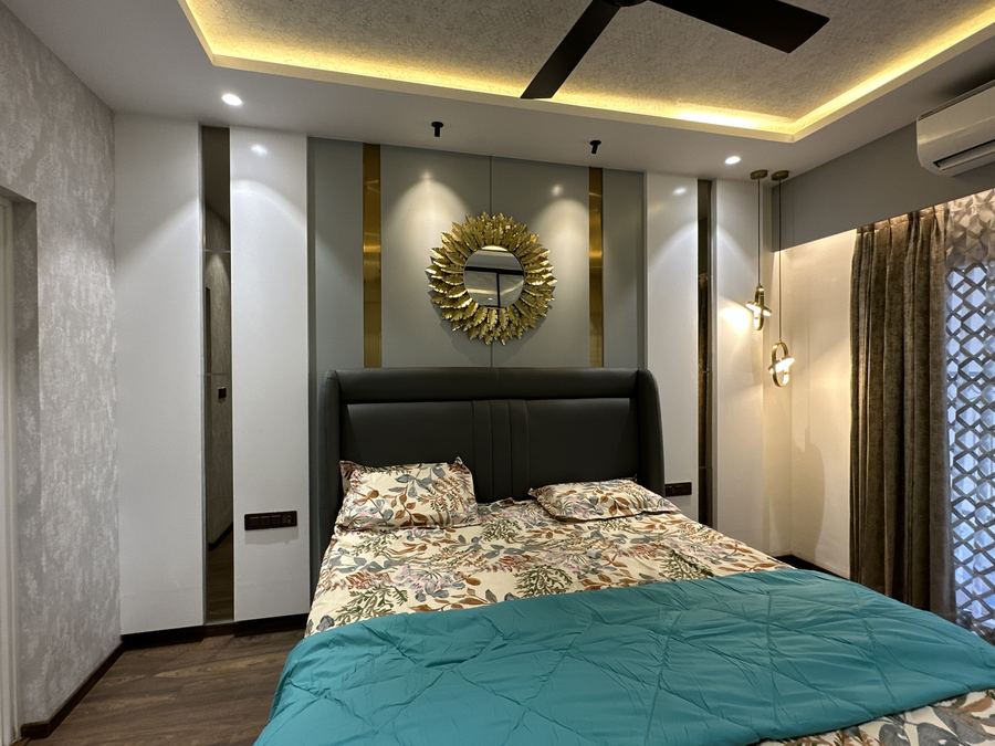 Bedroom with upholstered headboard and statement furniture