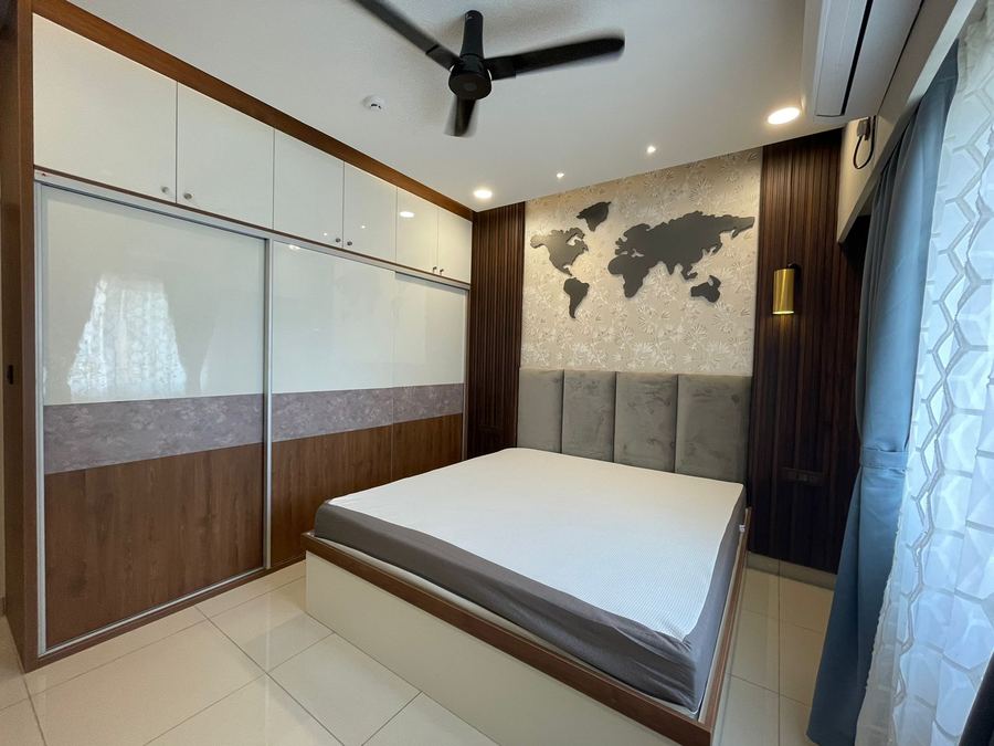 Bedroom with wood-panel wall and a world map wall art feature